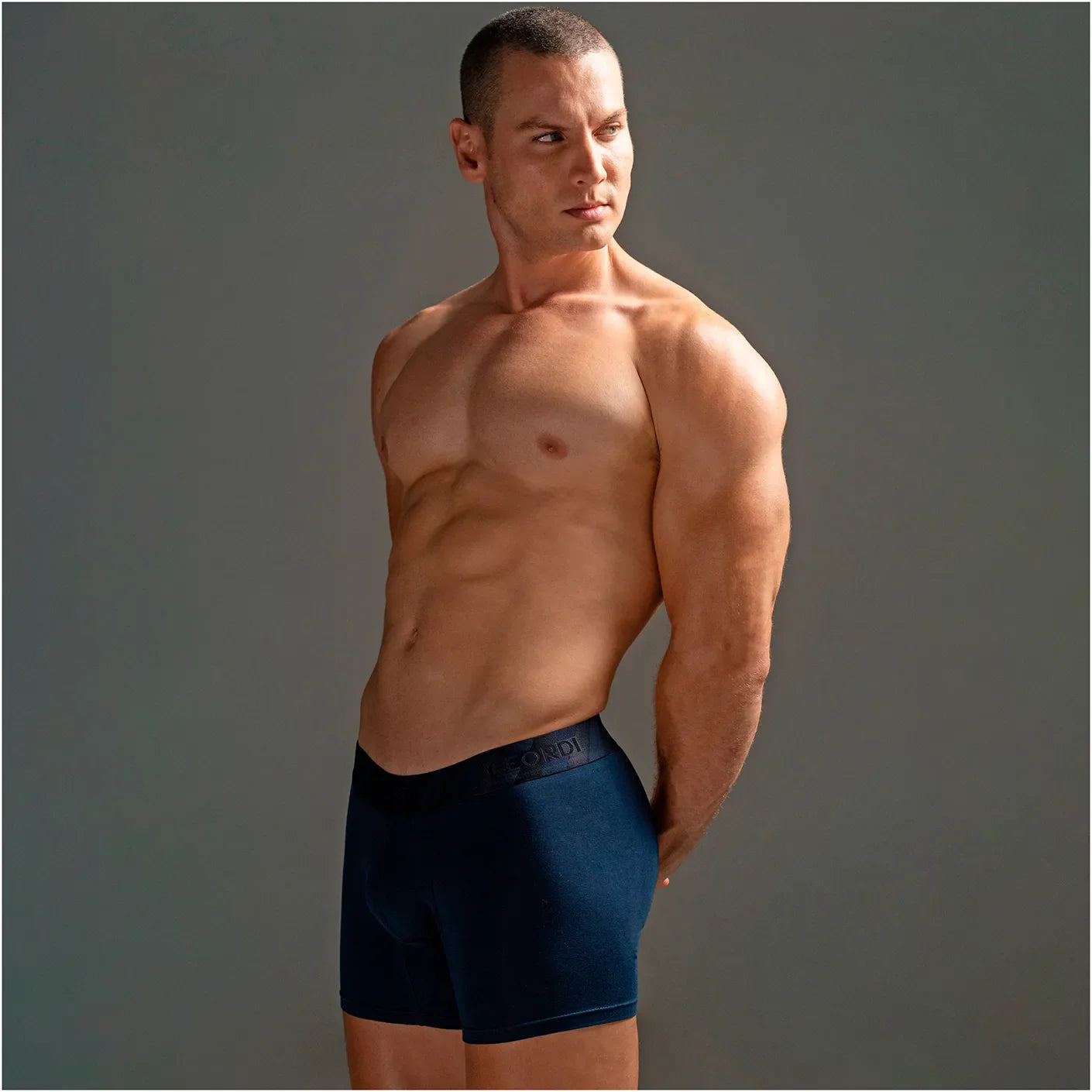 Diane Geordi B2148 navy blue men's boxer brief Colombian compression garment with elastic waistband front lifestyle view