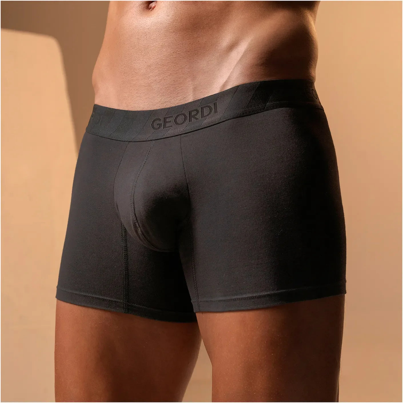 Geordi B2148 black men's boxer brief with branded waistband, comfortable Colombian compression garment front lifestyle view