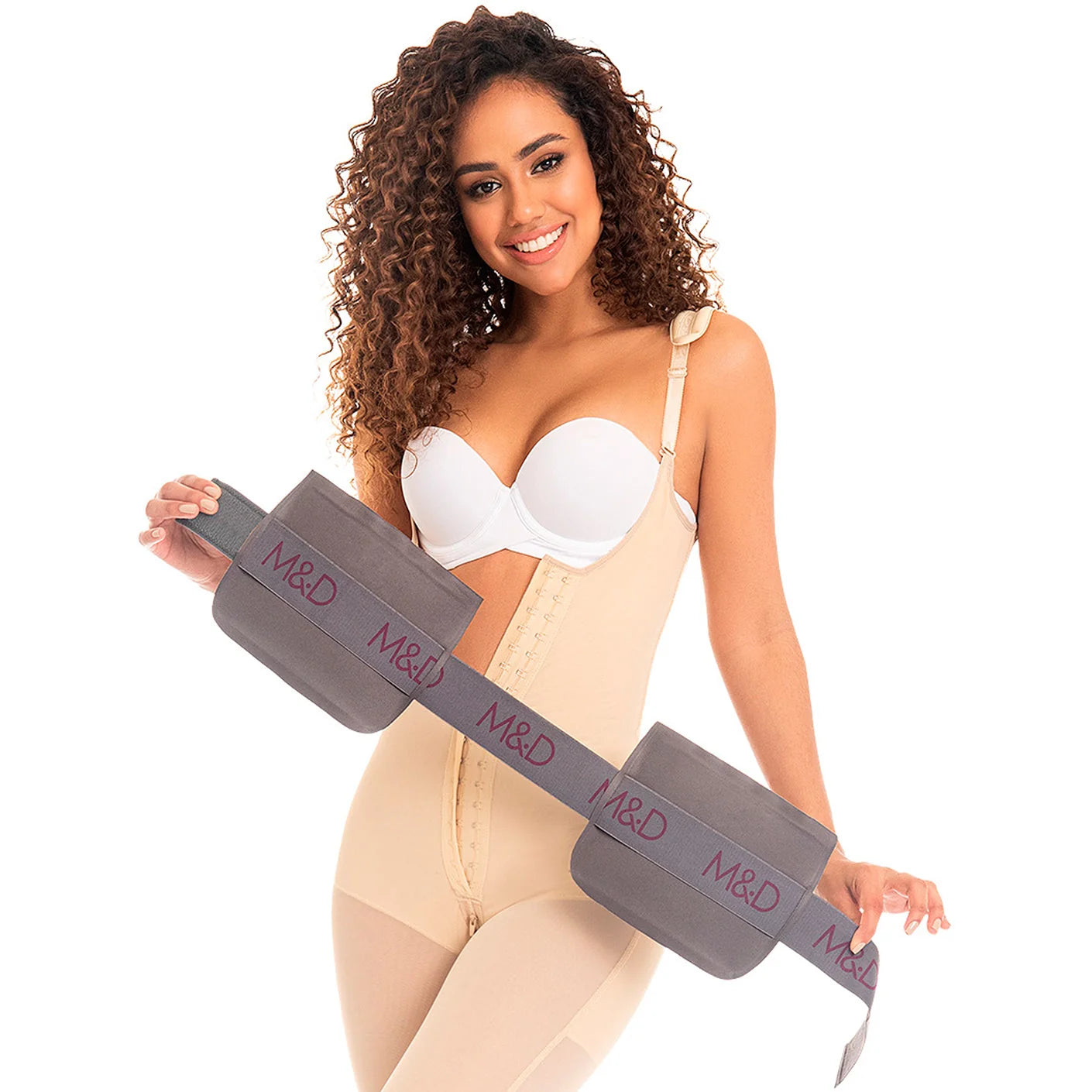Fajas MyD MYD107 beige full-body Colombian shapewear with gray M&D compression board, post-surgery faja lifestyle view