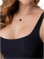 Fajas Salome BCB5 black four-leaf clover necklace lifestyle detail shot on Colombian shapewear bodysuit front view